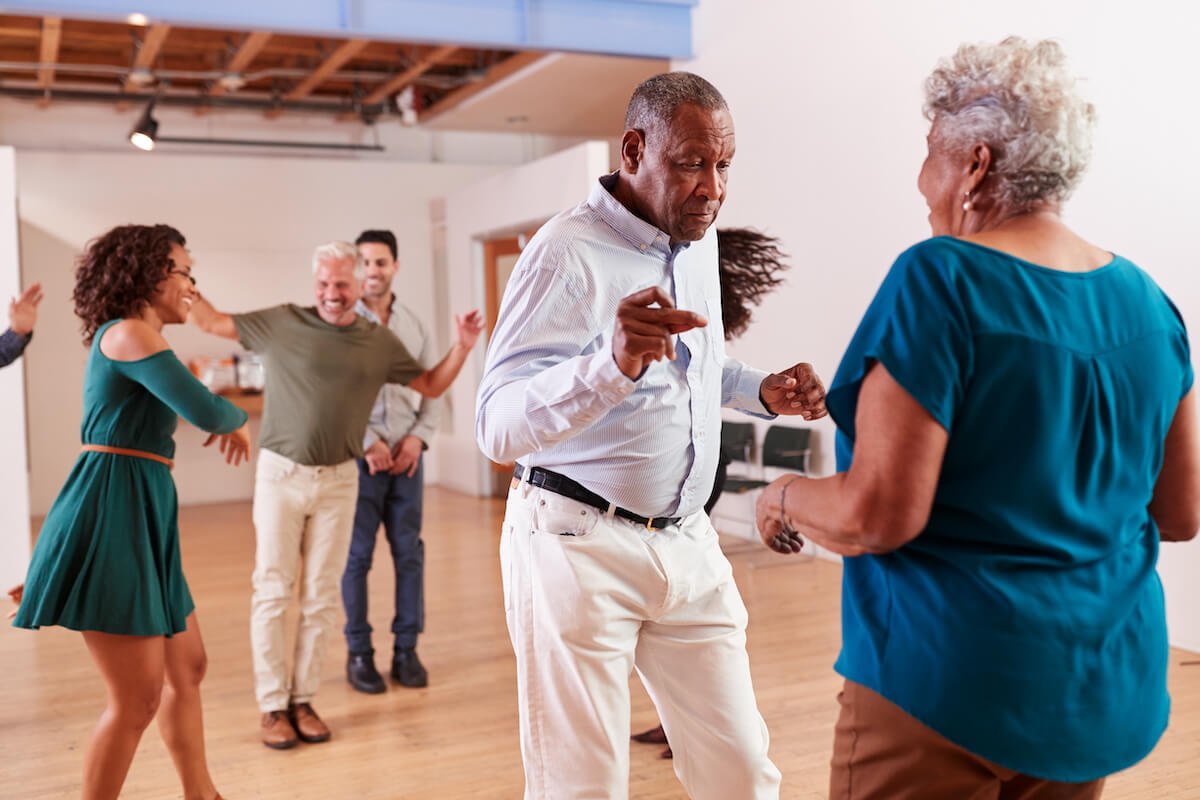 Older adults taking a dancing class