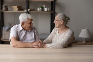 Senior married couple talking to each other