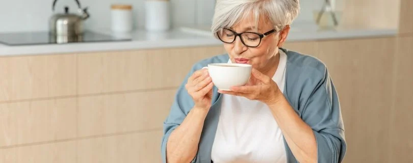 Older woman drinking tea