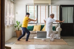 Older adults taking an online fitness class.