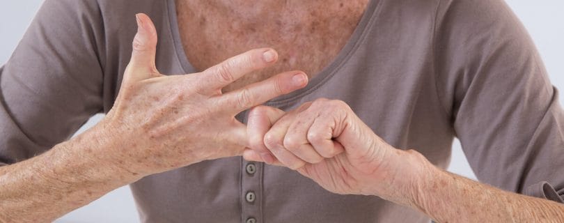 Older woman stretching her finger